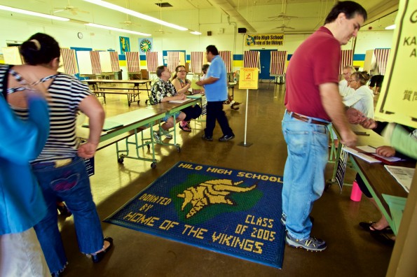 Voters at Hilo High School Cafeteria Tuesday (Nov 4) to cast their ballots in the General Election. Things appeared to be going smoothly in the early morning opening hour. Photography by Baron Sekiya | Hawaii 24/7
