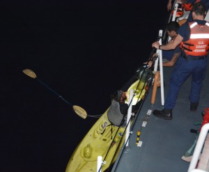 Crew members aboard Coast Guard Cutter Kiska, a 110-foot Island class patrol boat home ported in Hilo, rescue a distressed kayaker approximately 19 miles northeast of Kohala, Big Island, Jan. 13, 2015. The 38-year-old man left Maui en route Big Island when he became lost and called for assistance using his cell phone. Photo courtesy USCG