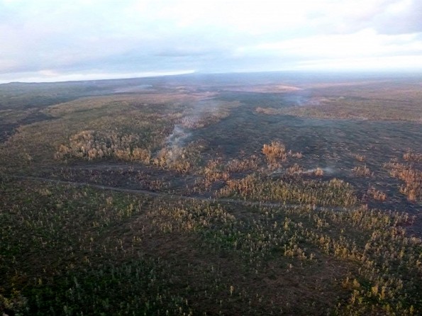 The Kilauea June 27th Lava Flow looking upslope past the firebreak Wednesday morning, February 18, 2015. Photo courtesy of Hawaii County Civil Defense