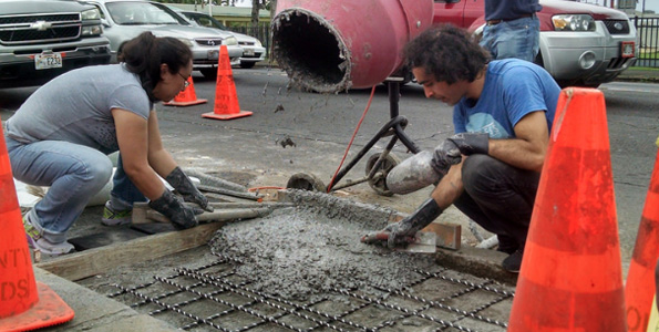 Civil engineering students from the University of Hawaii at Manoa work on the final slab of the three-section sidewalk of lunar concrete March 12 in downtown Hilo. (Photo courtesy of PISCES)
