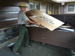 A Hawaii Volcanoes National Park ranger recycles cardboard at the Kilauea Visitor's Center. Photo courtesy of HVNP