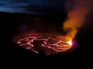 A wide view looking northeast, of the lake in Halemaʻumaʻu Crater as seen late Monday. Jaggar Museum and HVO are beyond the left edge of the photograph. Spattering was active in the southeast portion of the lake. The lava lake dropped more than 15 m (49 feet) between the time the photo was taken and mid-day Thursday (June 30). USGS photo. Photo taken Monday, June 27, 2016 courtesy of USGS/HVO