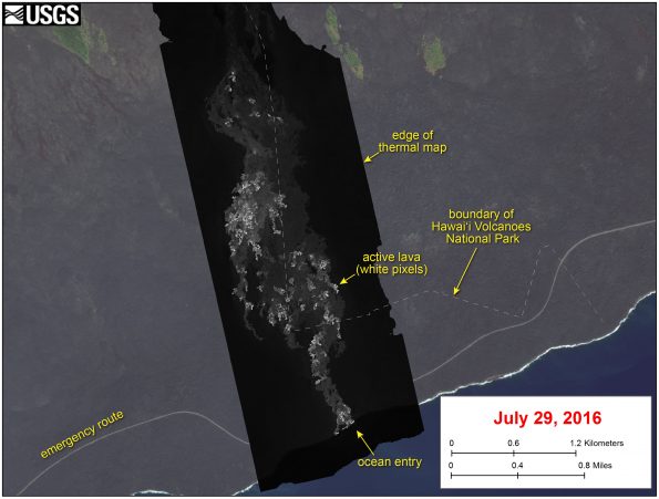 This image shows a thermal map of the flow on the pali and coastal plain, created from airborne thermal images. White pixels are hot, and show areas of active surface breakouts. The background image is a satellite image collected before the current lava flow was active. The thermal map shows scattered pāhoehoe breakouts on the coastal plain, with a narrow lobe of lava crossing the gravel road and extending to the ocean. The ocean entry has widened since it first formed on Tuesday, July 26, and now spans about 240 m (260 yards) of the coastline.