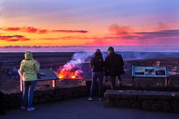 Visitors observe the lava lake within Halema‘uma‘u Crater from the Jaggar Museum observation deck at dawn. Photo courtesy of NPS Photo/Janice Wei