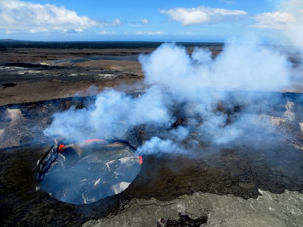 Aerial view of of the lava lake within Halemaʻumaʻu Crater at the summit of Kīlauea Volcano. The gas plume rising from the lava lake contains sulfur dioxide, which produces the volcanic air pollution (vog) that impacts the island. Kīlauea's summit vent is the primary source of sulfur dioxide. Photo courtesy U.S. Geological Survey Hawaiian Volcano Observatory.