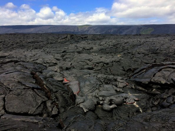 Wednesday (February 22, 2017), the breakout along the eastern edge of Kīlauea Volcano's episode 61g flow remains active and had advanced approximately 570 m (620 yards) since it was last mapped on February 14. The flow front consisted of sluggish, oozing pāhoehoe that was approximately 730 m (0.5 miles) from the ocean and 540 m (0.3 miles) from the emergency route road. Channelized lava flows have been recently reported on Pūlama pali, but no active channels were seen by HVO geologists while working in the area this afternoon. They did, however, observe scattered breakouts on the pali. Photo taken Wednesday, February 22, 2017 courtesy of USGS/HVO