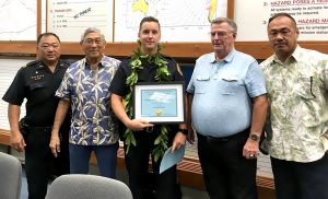 Pictured from left to right: Captain Randall Ishii, Mayor Harry Kim, Officer Tyler Prokopec, Bill King of Securitas, and Wesley Taketa of Royal Kona Resort