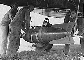 A 600 pound bomb being loaded onto a Keystone B-3A Bomber on December 27, 1935 to bomb Mauna Loa's lava flow. Photo via National Park Service Archives.