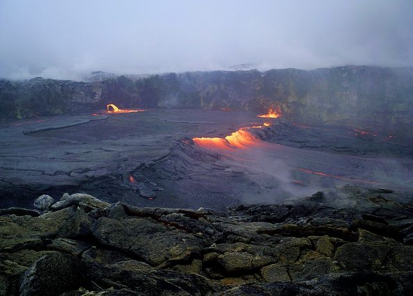 Overflows from the perched lava pond within west pit, a small crater adjacent to the main Pu‘u ‘Ō‘ō crater on Kīlauea Volcano’s East Rift Zone, continue to build up the levees around the pond. The rising level of the perched lava pond during the past month is a sign of the increasing pressure within the magma system beneath Pu‘u ‘Ō‘ō. This overflow, captured by a USGS-Hawaiian Volcano Observatory time-lapse camera, occurred on April 17, 2018. Photo taken Tuesday, April 17, 2018 courtesy of U.S. Geological Survey