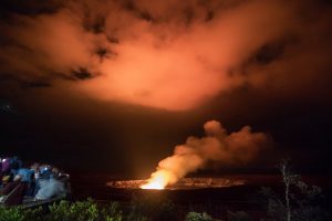 Visitors at Jaggar Museum overlook on Sunday evening enjoy the glow emanating from the lava lake deep within Halema‘uma‘u Crater. Temporary new operating hours for the park are 7 a.m. to 10 p.m. daily. Photo courtesy of NPS Volunteer Janice Wei