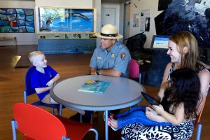 Ranger Keoni interacts with visitors at Mokupāpapa Discovery Center earlier this week. NPS Photo/Janice Wei.