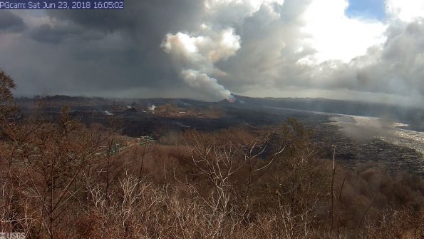 This image is from a temporary research camera positioned near Kapoho looking southwest. From left to right, one can see the eruptive fissures, with Fissure 15 on the far left, and Fissure 8 near the center. Webcam image taken Saturday, June 23, 2018 courtesy of U.S. Geological Survey
