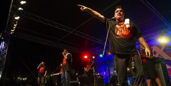 Ke‘ala Kawa‘auhau (right) sings onstage in the group Sudden Rush at the 2016 KWXX Hoolaulea in Hilo, Hawaii. Photography by Baron Sekiya | Hawaii 24/7