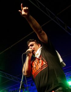 Ke‘ala Kawa‘auhau sings onstage in the group Sudden Rush at the 2016 KWXX Hoolaulea in Hilo, Hawaii. Photography by Baron Sekiya | Hawaii 24/7