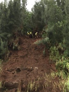 Crews work to mitigate possible landslides and loose boulders on the slopes of Kaawalii Gulch Saturday, August 25, 2018. HDOT Photo
