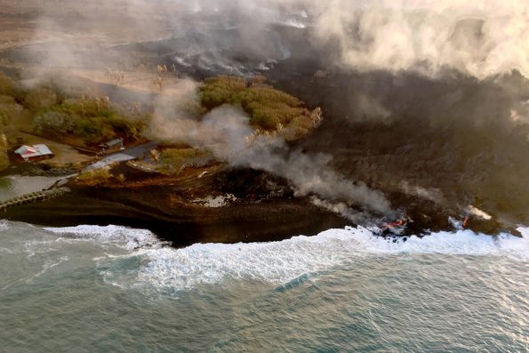 On August 9, 2018, visibly active lava on Kīlauea Volcano’s lower East Rift Zone was limited to a small pond deep with the fissure 8 cone and small streams of lava oozing into the ocean near Isaac Hale Beach Park (shown here) and at Kapoho Bay. USGS scientists are closely monitoring the volcano, watching for any signs that might indicate if Kīlauea’s rift zone eruption and summit subsidence are pau or paused. USGS photo by I. Johanson.